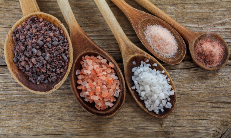 Variety of salts in spoons